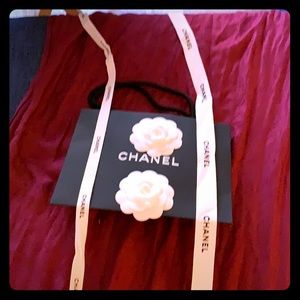 One small Chanel shopping bag and ribbons